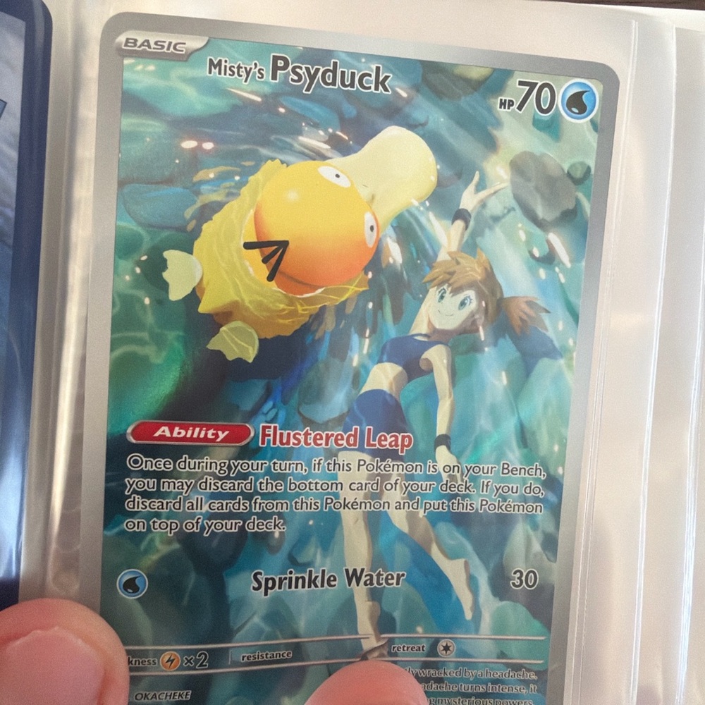 Misty’s Psyduck illustration art, Z,s Zoroark Ex gold card play bonus card